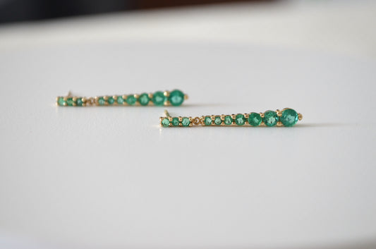 Aretes colgantes en oro amarillo 14K con Esmeraldas